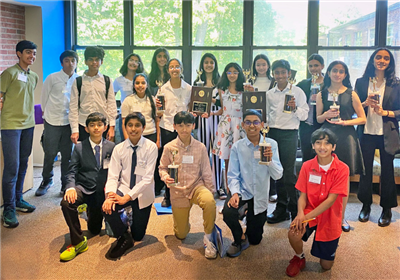  middle school debate team members with awards